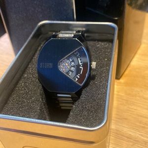 London storm brand jump hour watch. Black & silver.